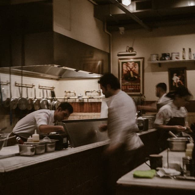 Chefs working in a busy commercial kitchen